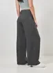 Calça Pantalona Em Tecido Preto Estonado
