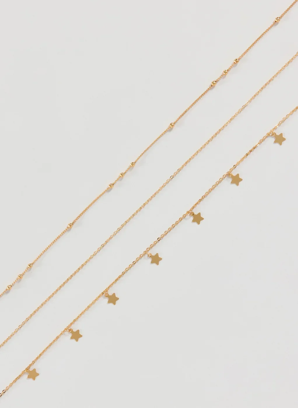Body Chain Dourada Estrelas