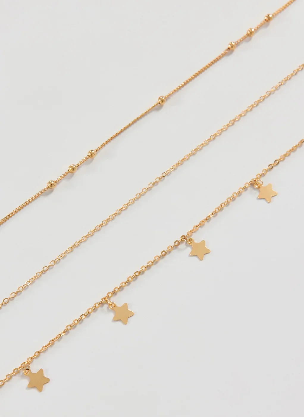 Body Chain Dourada Estrelas